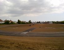 Eastwood School, South End on Sea Essex. A new build Mondo Athletics track, preparing the infield area ready for grass seeding.